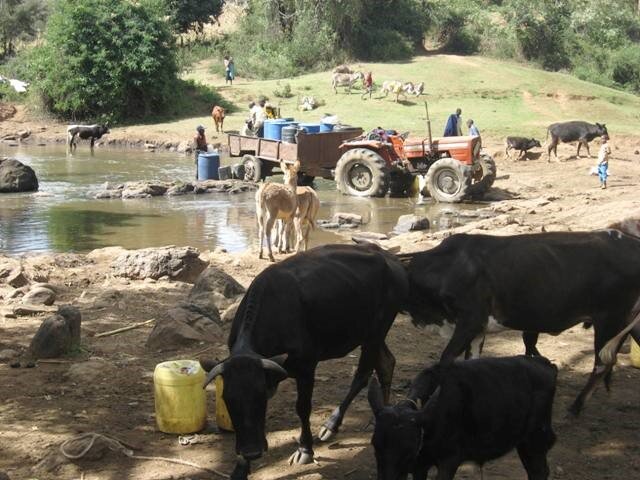 A water extraction pump and pipe drawing from the Amala River