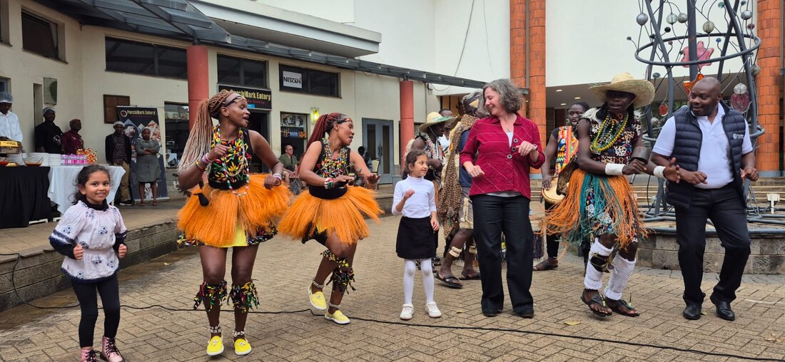 Dancers performing with visitors and museum staff at the opening of the Mara River exhibit